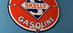 Plaque d'annonce Vintage Skelly Gasoline en porcelaine pour station-service de pompe à essence.
